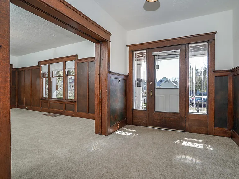 Foyer to Front Porch Entry: New Carpeting, Beautiful Original Woodwork, Wainscot & Leaded 
Windows.
