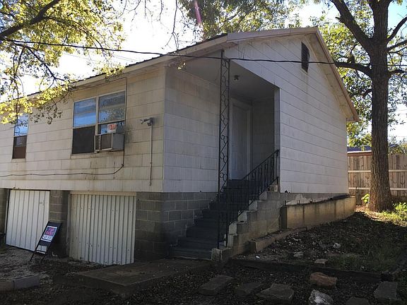 front view of unit from street whic h shows steps to enter unit. Also you will notice the motion light on the East wall.