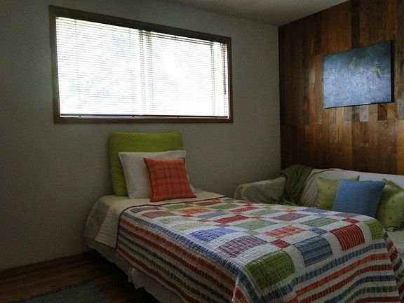 One of two main floor bedrooms with hardwood floors and newer interior doors plus newer windows.