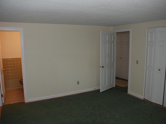 Master bedroom with wall to wall carpet