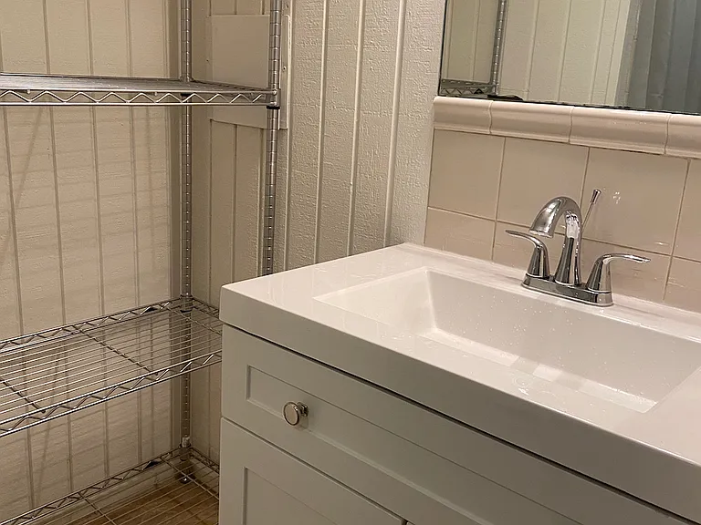 Bath vanity and shelving.