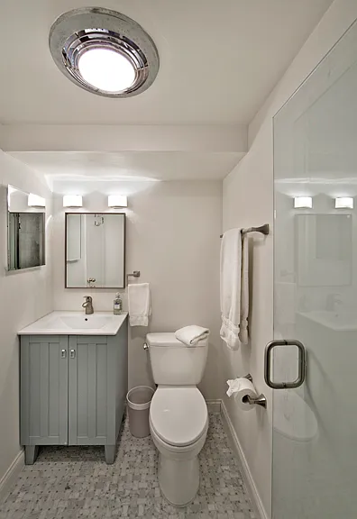 Bathroom with stall shower. Towels provided