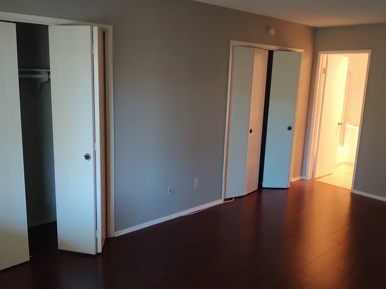 Bedroom with closets (whole inside wall is closet space)
