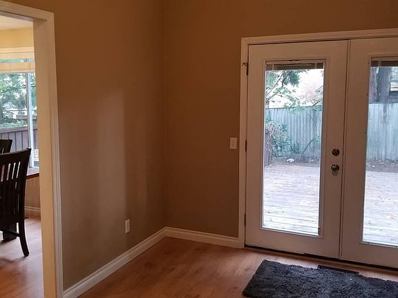 Family Room with view to Dining Room and French Doors to the back deck