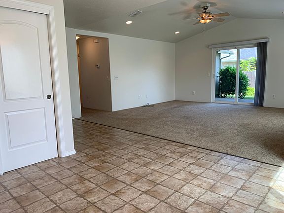 Dining room and living room, slider goes out to covered patio and beautifully landscaped yard