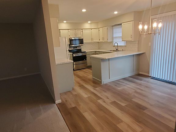 New stove, refrigerator, microwave, and dishwasher.