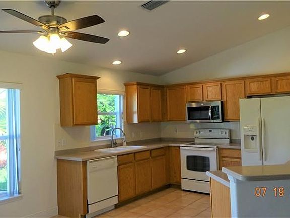Tons of cupboard space here & Corian countertops.
