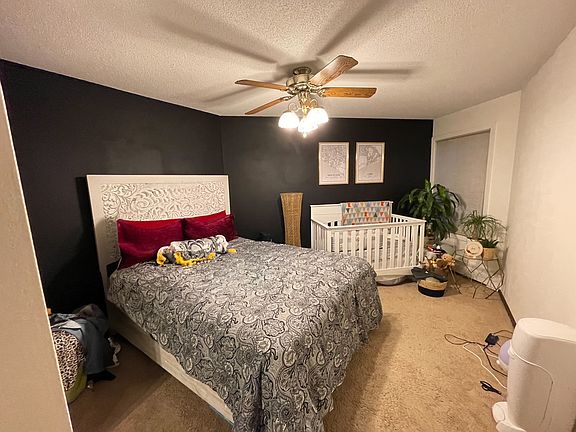 bedroom large enough to fit queen bed and extra square footage to put a desk, crib, lounge area.