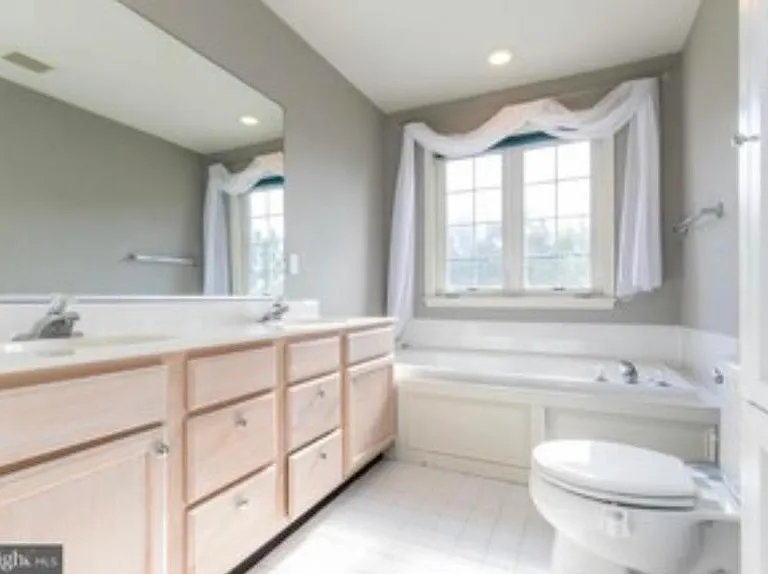 Double Vanity with Jacuzzi Tub.