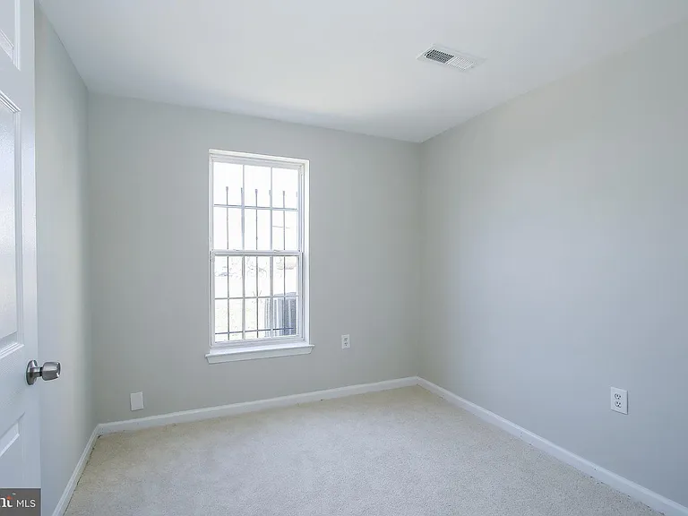 Downstairs bedroom with ample light.