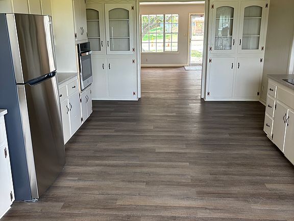 Kitchen with new appliances adjacent to den