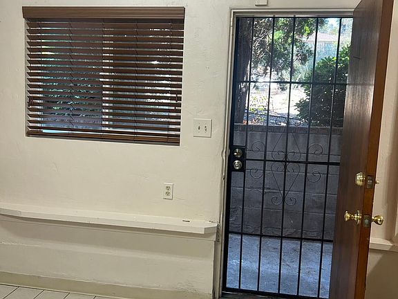 Kitchen window and security door for added light and fresh air.