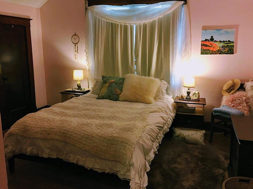 Cozy master bed with electric fireplace. Large closet and dresser. Night stands also have drawers for storage