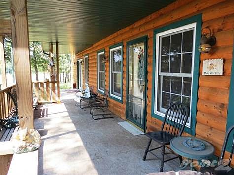 RELAX ON YOUR PEACEFUL FRONT PORCH OVERLOOKING 3-ACRE LAKE!