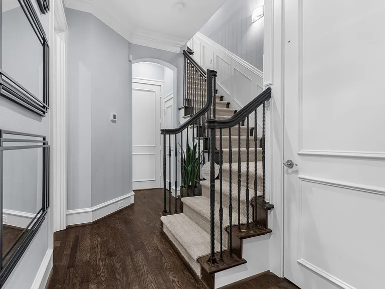 Elegant entrance hallway with a modern staircase leading to the upper floors.