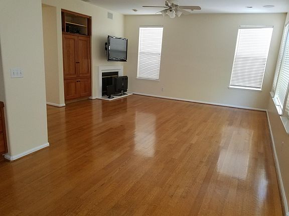 FAMILY ROOM WITH TV, CEILING SPEAKERS AND FIREPLACE