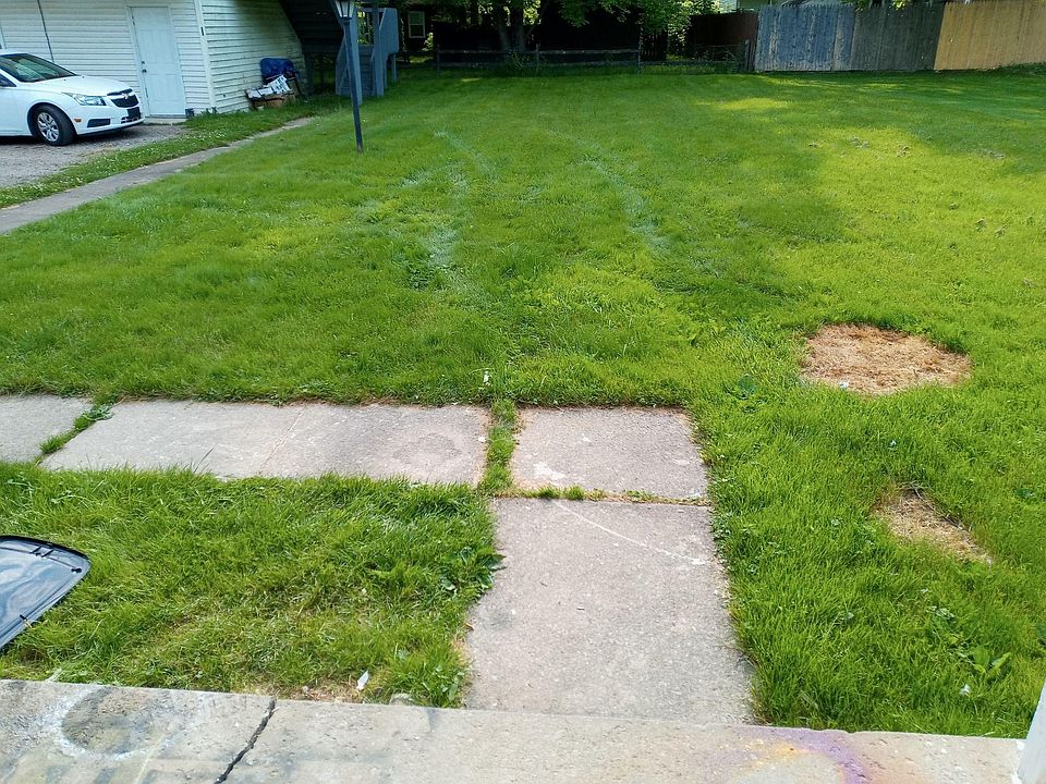yard and parking lot on the left.