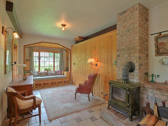 Family room with built-in window seat and wood burning stove