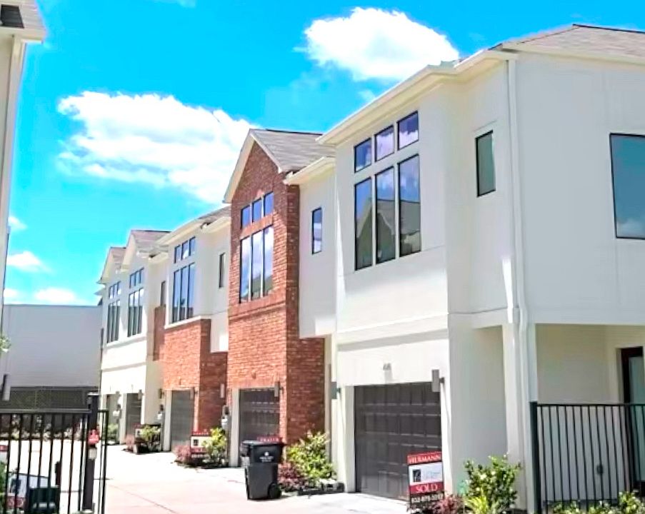property featuring a brick facade in a gated community