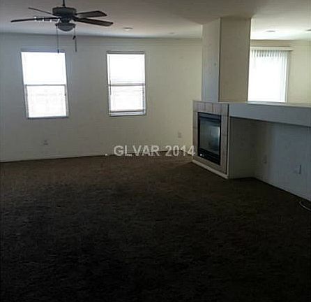 Living room w/ fire place and niche