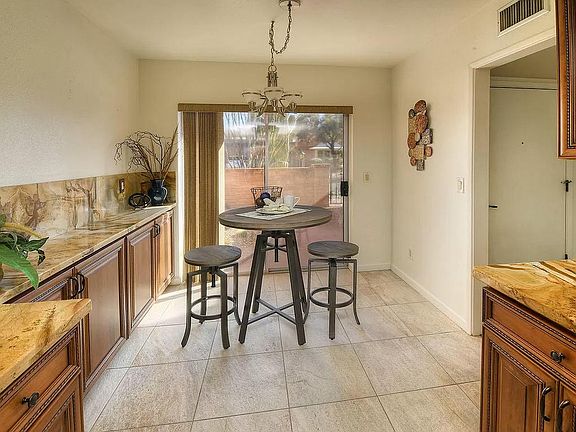 In-kitchen breakfast area opens to front courtyard
