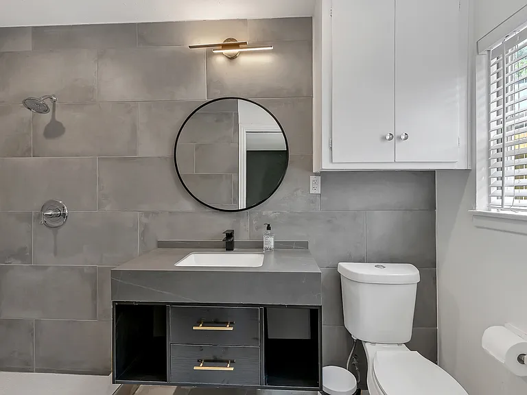 Enjoy the gorgeous remodeled bathroom with a lovely shower and Van