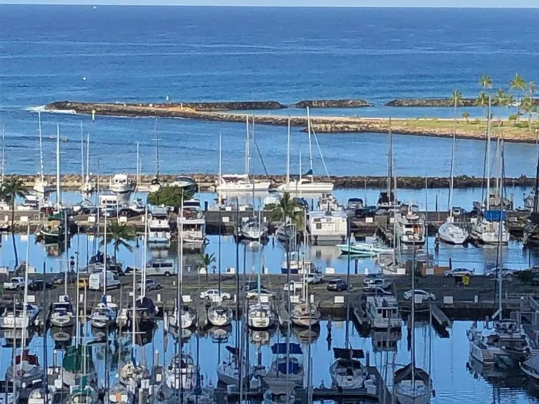 Location shot only, not view from unit. Shows Magic Island Ala Moana Beach Park (taken from building) and Ala Wai Yacht harbor.