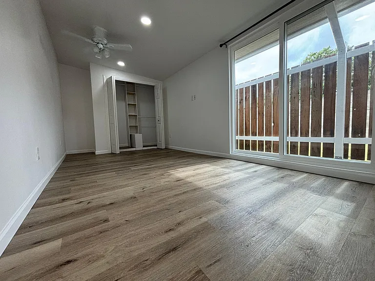 Large Bedroom with Closet organization system & sliding door