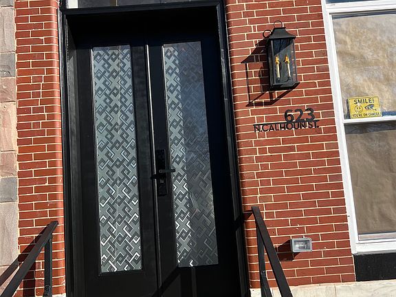 Front door with new rails, keyless entry and security film on glass doors.