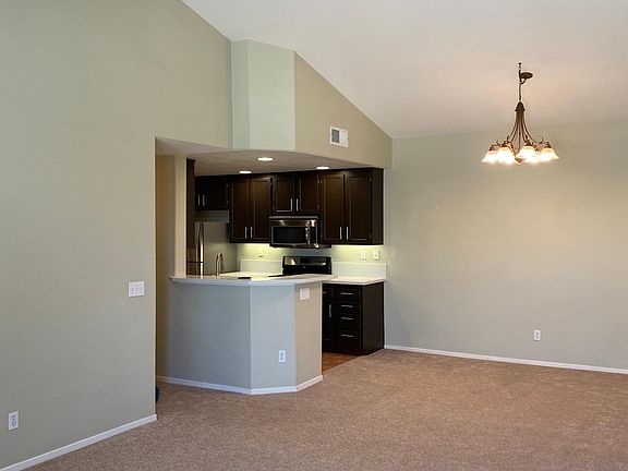 Vaulted ceilings, spacious living room and dining area.