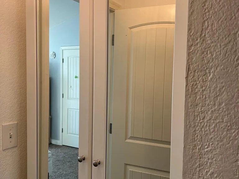 Tall mirrored cabinet in bathroom