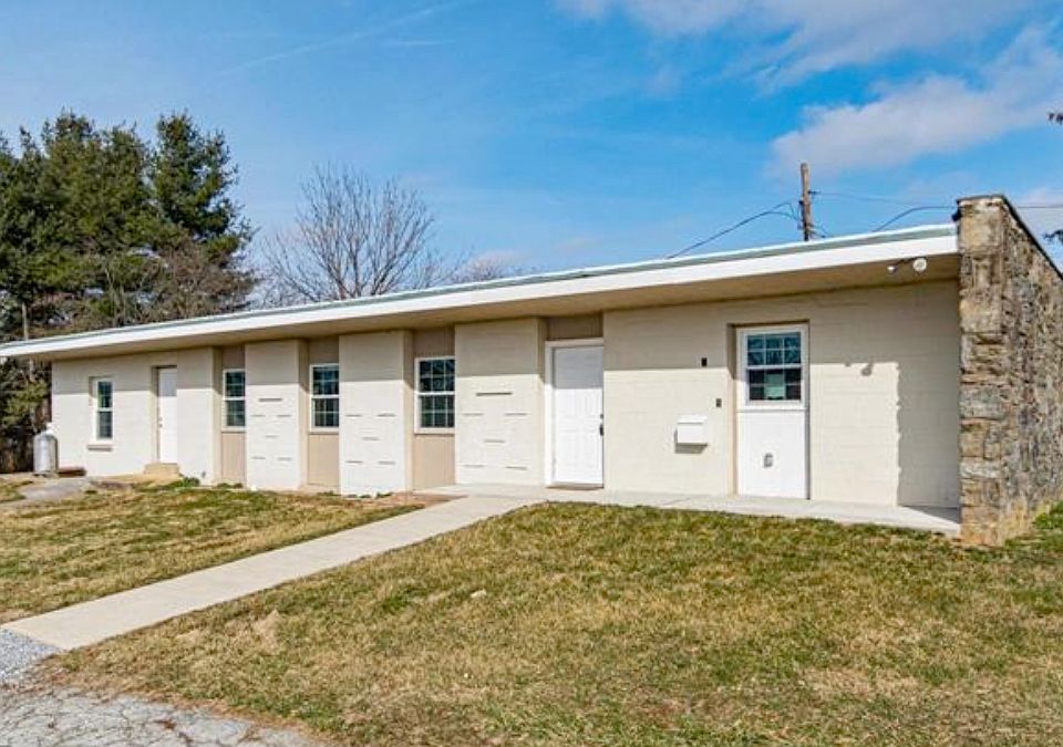 Front view - This is a 1-story Ranch House (2100 sf) with additional 550+ sf full basement and more partial basement