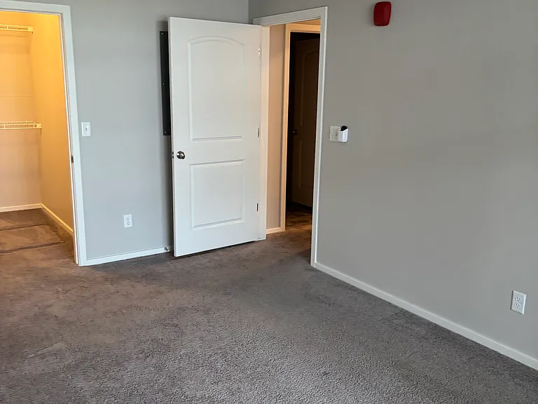 Large bedroom with ceiling fan.