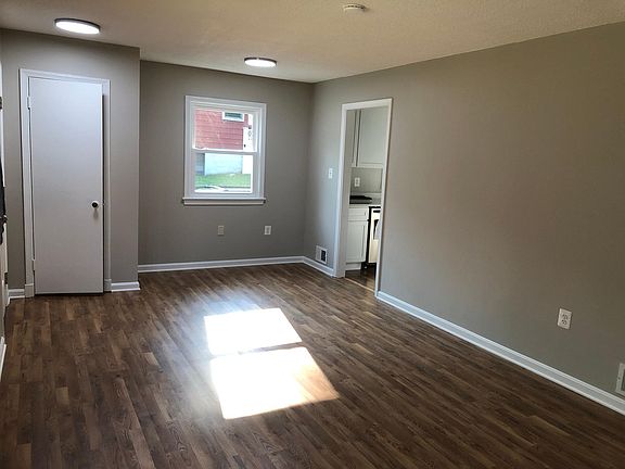 LIving room with access to the kitchen.