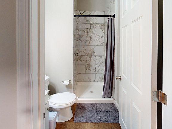 Room 6 - Private newly renovated bathroom with stand up shower, gorgeous tile and bright lighting.