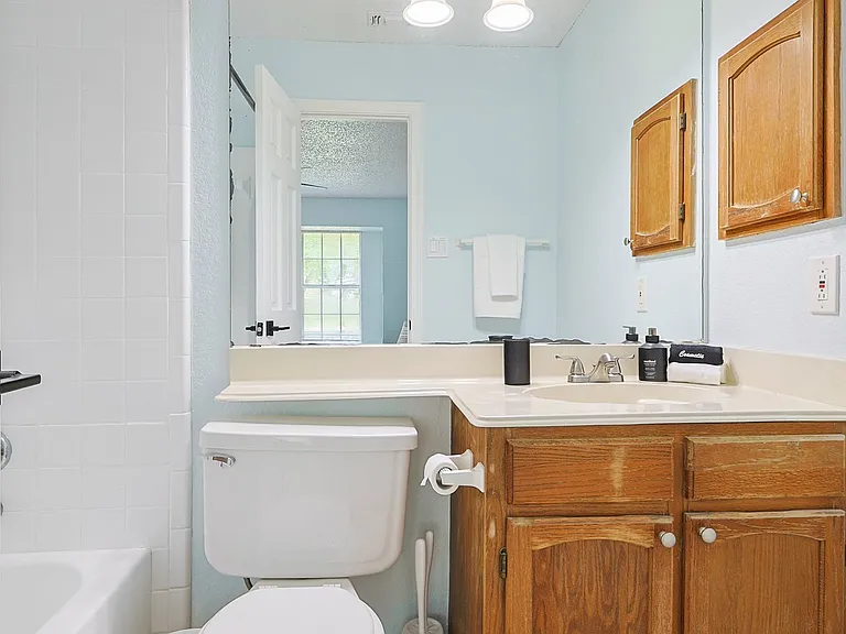 Full Bathroom 1 - shower-tub combo and bathroom essentials.