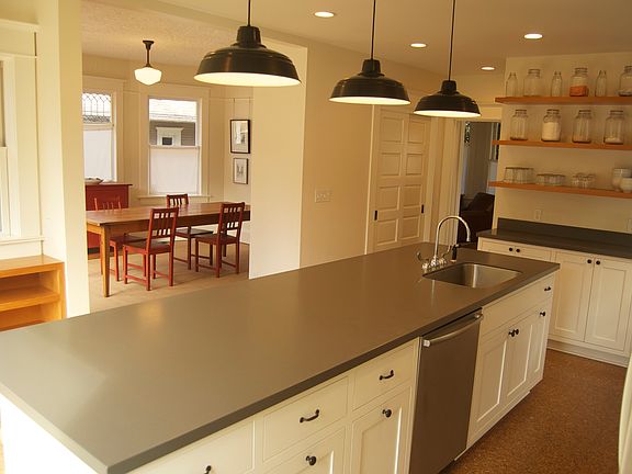 Kitchen opens onto dining room