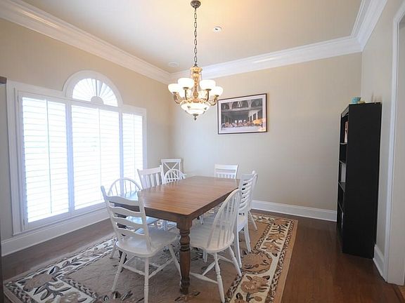 Spacious dining room with custom blinds