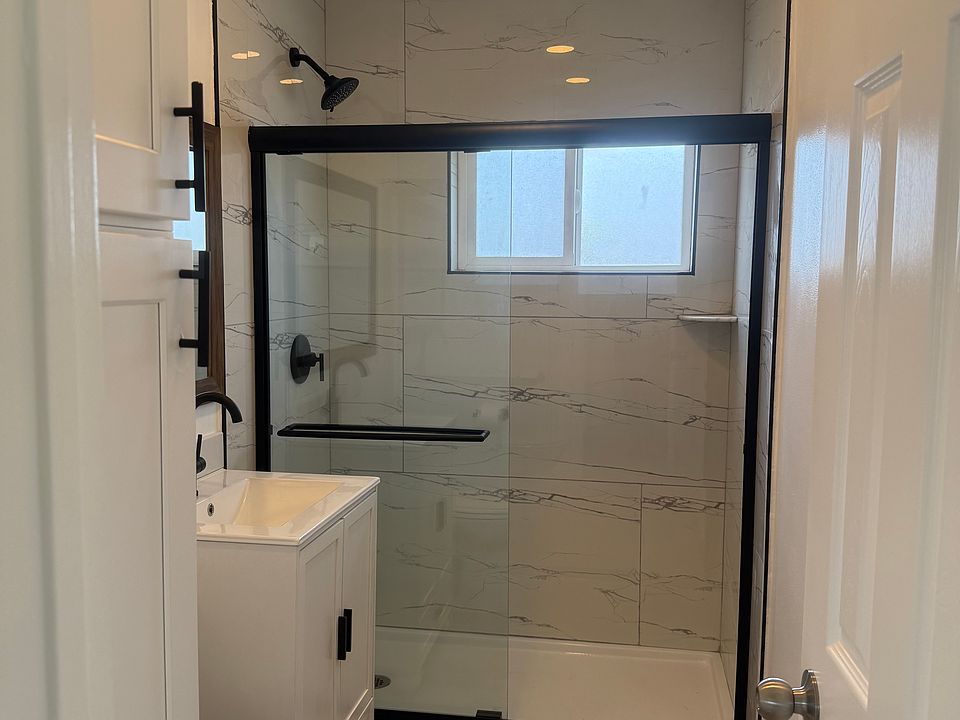 Bathroom
New Tile Shower, vanity, toilet and pantry size storage cabinet