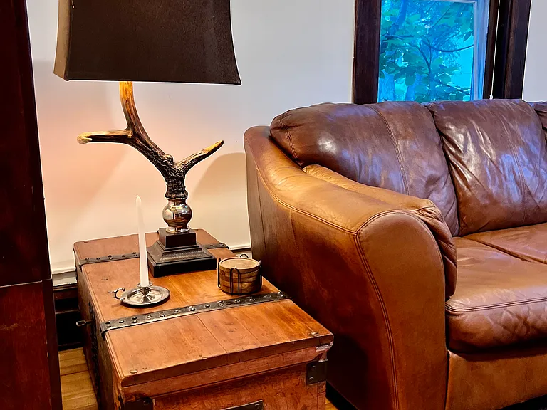 The apartment is filled with a nice blend of new and intiquitous furniture with tons of character.