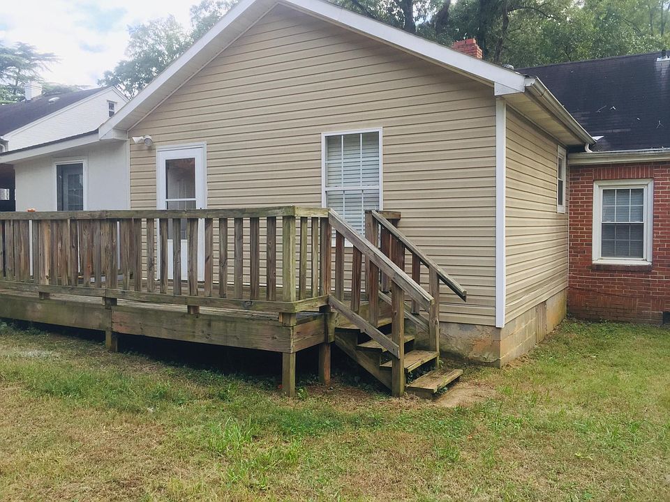 Back of the house with a deck