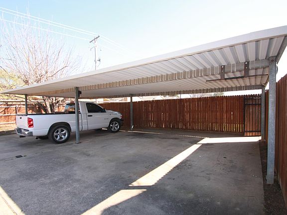 Rear covered parking with Dusk / Dawn Security Lights