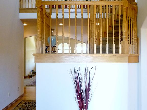 Entry with stairs. Hallway to left leads to formal living room.