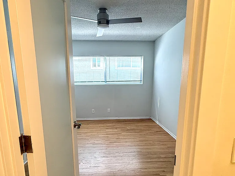 Partial view of the bedroom from the bathroom