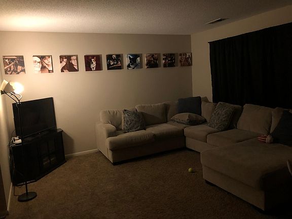 Living room space. Very very large couch for scale