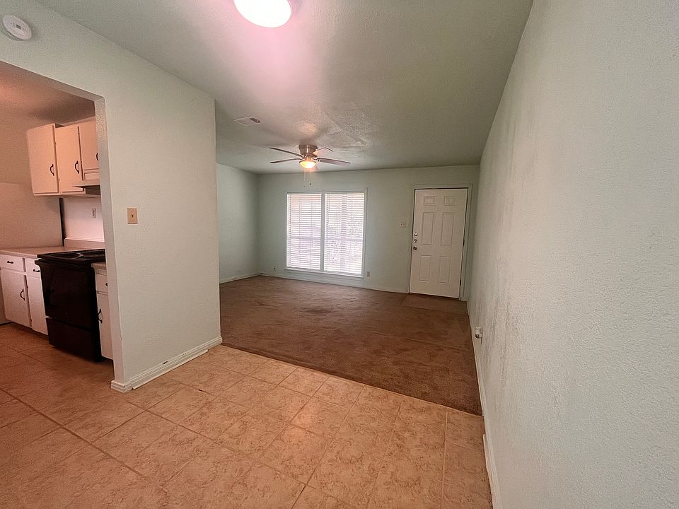 Dining area looking into kitchen/living