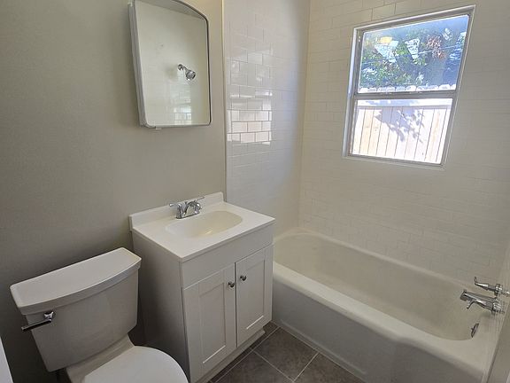 New tile, vanity, and toilet