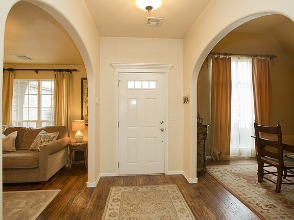 Warm Foyer with Graceful Arches