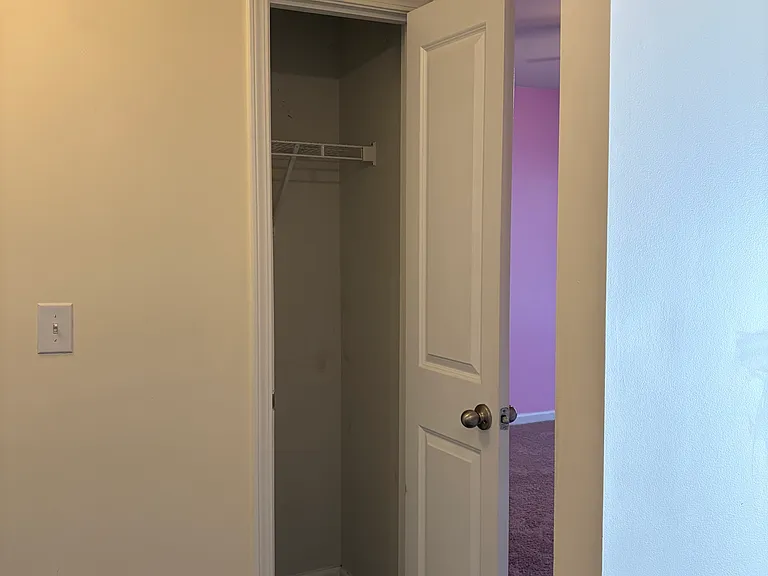 Front hall closet between bedrooms