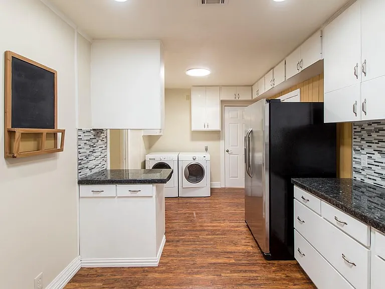 door in back to 4th bedroom. left of washer/dryer is door to 2nd bath & 3rd bedroom